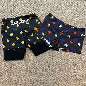 2 pairs of running shorts. Love The Pain and Feed Me Fight Me size L